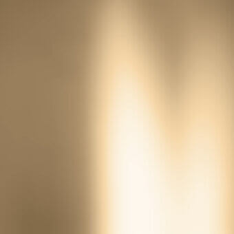 Gradient background, tan to white, with diffused light leak effect and smooth surface, creating an ethereal, abstract luminous wash.