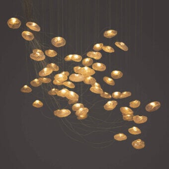 Superior Bocci 73 sculptural cable suspension lamp with warm golden amber blown glass and brushed nickel canopy