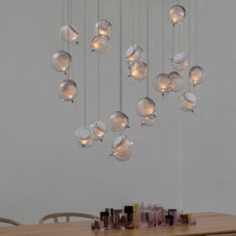 Captivating Bocci 76 Random suspension lamp crafted in clear and white hand-blown glass with a white powder-coated canopy and copper mesh
