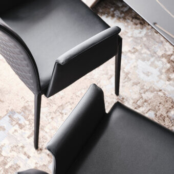 Exclusive Cattelan Italia Norma chair in black synthetic leather with quilted seatback and matte finish