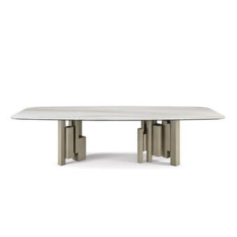 Cattelan Italia Skyline table, ceramic tabletop with grey veining, dark grey metal geometric base, modern minimalist design, studio shot.