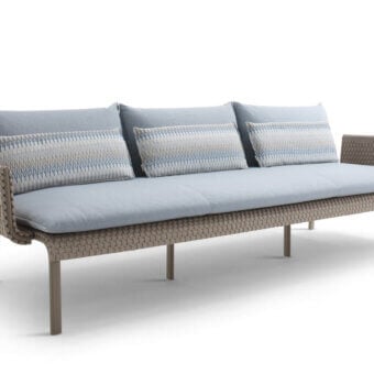 Sophisticated Roberti Rattan Key West sofa with durable Sunrope and Cipria powder-coated aluminum frame, contrasted by plush light blue cushions