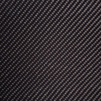 Fibracarbonio texture displaying a dark gray woven carbon fiber pattern in a diagonal rectangular grid with a subtle glossy sheen.