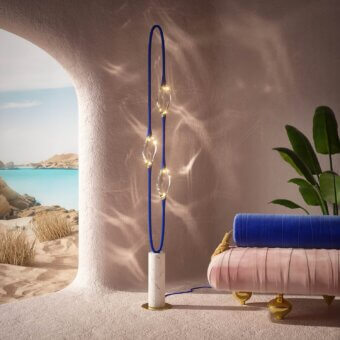 Distinguished Il Pezzo 12 floor lamp with circular rotation, three crystals and a marble base in gold-colored metal