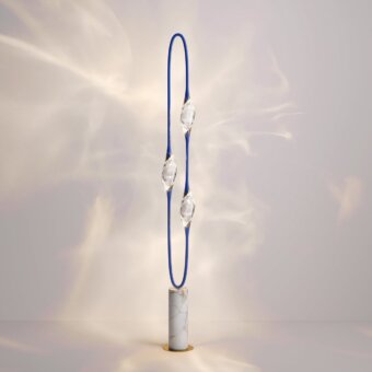 Captivating Il Pezzo 12 floor lamp with rotating light sources and a pure marble base crafted in blue with clear crystal accents
