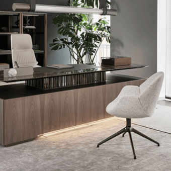 Elegant Giorgetti Calathea Bergere chair in light gray woven textile with a dark-toned metal swivel base
