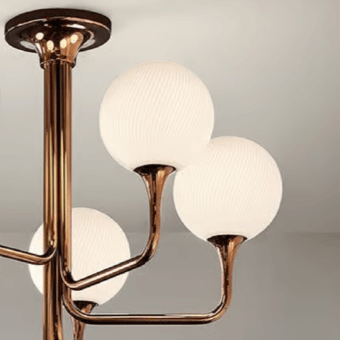 Elegant Masiero Tee ceiling lamp with curved arms supporting opaque white spherical lamps in glossy copper-like metal