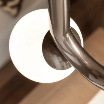 Captivating Masiero Visio suspension lamp with curved metal frame and spherical Murano triplex glass diffuser in a dark glossy finish