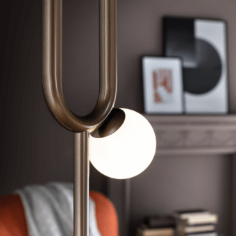 Superior Masiero Visio floor lamp with a curved metal frame and Murano glass diffuser in bronze tone