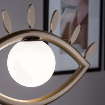 Exceptional Masiero Visio table lamp with a surreal eye-shaped design crafted in painted metal and Murano triplex glass with a muted gold finish