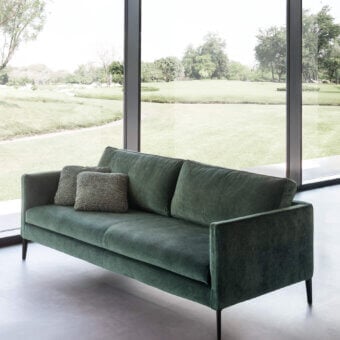 Lavish Presotto Raffaello sofa built in dark green textile with matte finish and black painted metal feet