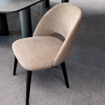 Distinguished Presotto Sandalo chair with warm beige textile upholstery and matte black Ash legs presents a modern aesthetic with a backrest cutout