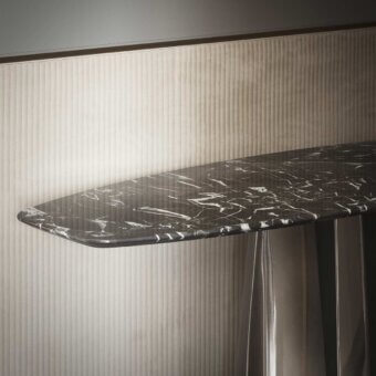 Elegant Rugiano Absolute console with black marble top exhibiting delicate white veining and unique metal structure
