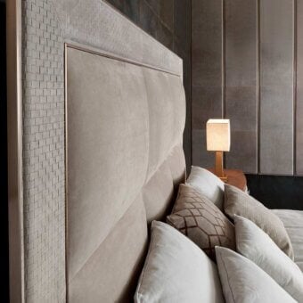Superior Rugiano Aura bed upholstered in light brown textile with diamond segments and rose gold metallic frame with woven gray accents