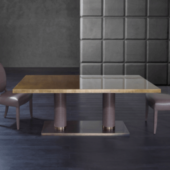 Distinctive Rugiano Fujico table with decoro painted wood and leather column legs in a chrome base