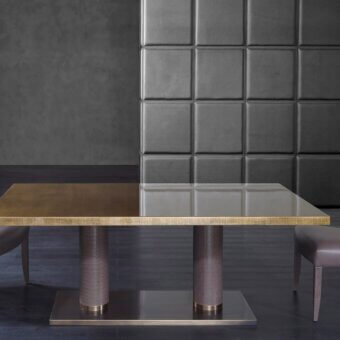 Superior Rugiano Fujico table with cylindrical leather legs, luxurious leather top and sleek Chrome base finish