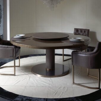 Distinguished Rugiano Fujico table with a dark brown painted wood top and bronzed brass cylindrical pedestal base