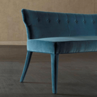 Lavish Rugiano Guendalina bench with curved backrest and plush seat upholstered in rich blue textile with a smooth finish
