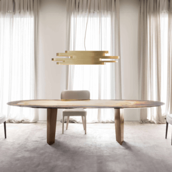 Distinguished Rugiano Pedro table with swirling browns, creams and gold atop bronzed brass block legs
