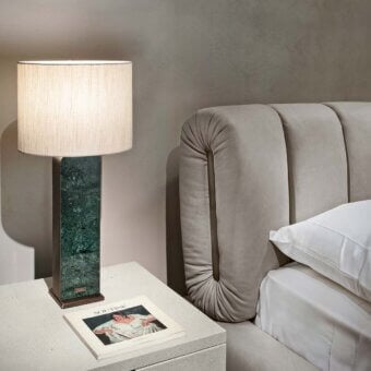 Distinguished Rugiano Snake bed with smooth muted grey textile upholstery and distinctive curved vertical panel detailing crafted in Italy
