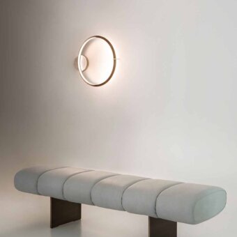 Distinguished Rugiano Snake bench with a light gray segmented seat upholstered in luxurious textiles and sleek dark wooden legs
