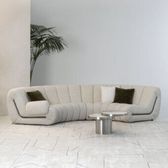 Superior Rugiano Snake sectional with light beige textile upholstery and dark accent outlining a curved form