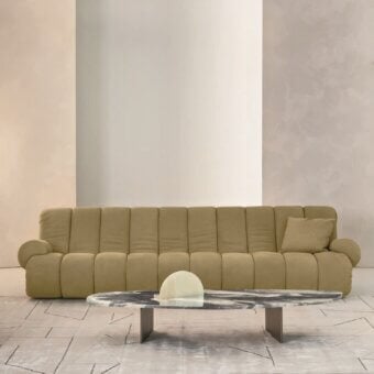Sophisticated Rugiano Snake sofa with pillowed backrest wholly upholstered in muted tan textile and seamless construction