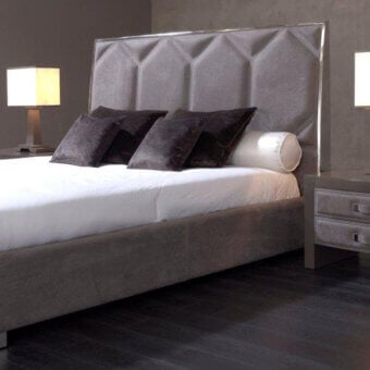 Distinguished Rugiano Souffle bed with tall geometric headboard and matte gray textile upholstery with bronzed brass trim