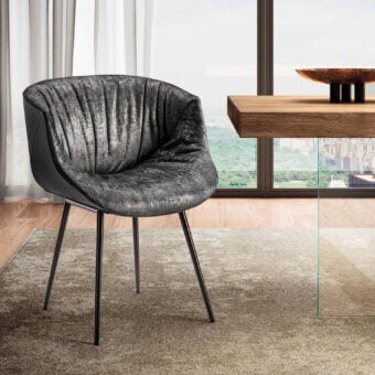 Superior Lago Nacho armchair with textured gray textile upholstery and dark metal legs exhibiting a contemporary aesthetic