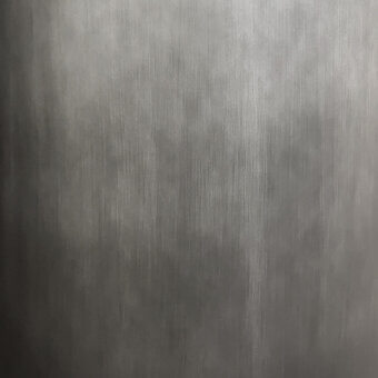 Gray gradient texture with vertical striated lines, matte finish, and uniform surface displaying subtle tonal variations in a grayscale palette.