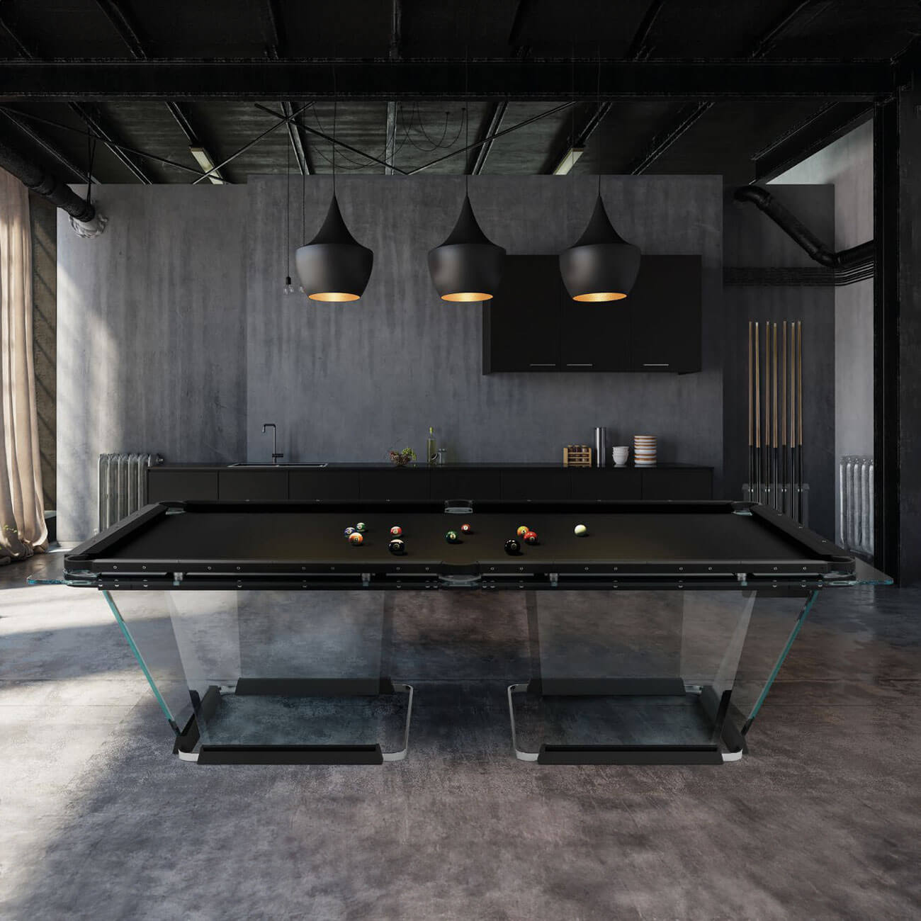 Billiards table with black felt surface and glass base, in industrial interior with gray kitchen island and pendant lights.