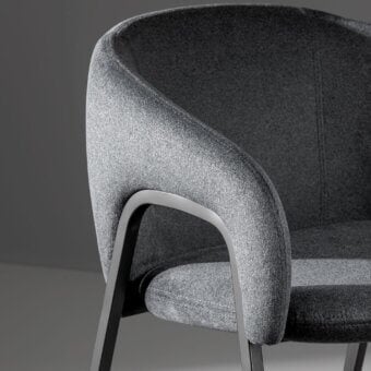 Elegant Bonaldo Alley armchair with medium gray textured fabric upholstery and a matte metal frame