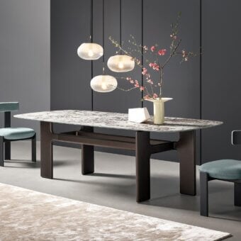 Sophisticated Bonaldo Hippos table with marble-patterned top and dark brown high density matt painted base presents changing visual strength