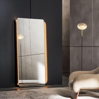 Sophisticated Bonaldo Olos mirror crafted in light-colored wood with an inwardly curved platform and leaning design