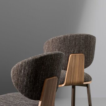 Sophisticated Bonaldo Olos stool in dark speckled brown textile with veneered wood backrest and refined metal legs