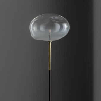 Distinguished Bonaldo Pepita floor lamp with organically shaped clear glass shade and golden metallic accents