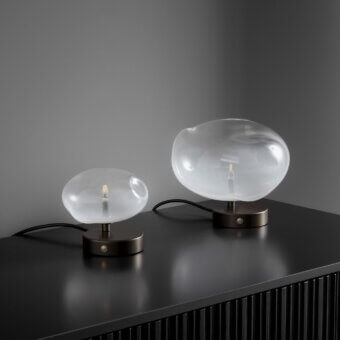 Distinguished Bonaldo Pepita table lamp with silk glass lampshade and dark bronze or gray metal base crafted in Italy