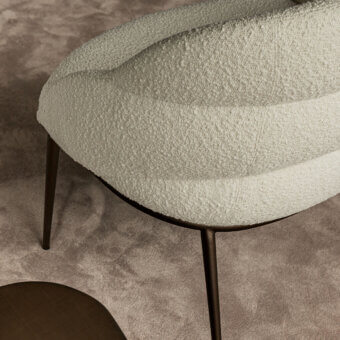 Superior Cattelan Italia Camilla lounge chair upholstered in soft off-white boucle fabric with bronze finished metal legs