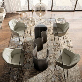 Exceptional Cattelan Italia Papel table with a sinuous base and clear glass tabletop crafted in dark-toned materials