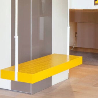 Exceptional Lago Soft Swing swing with a bright yellow lacquered wood and foam seat suspended by coiled white ropes