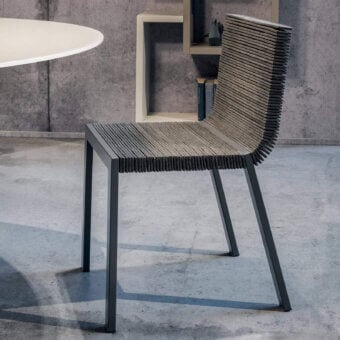 Distinguished Lago Steps chair with dark aluminum frame and horizontally aligned felt seat back in mixed grey beige tones crafted in Italy