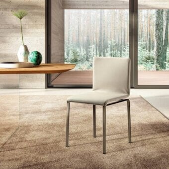 Distinguished Lago Dangla chair with a comfortable ergonomic form and light neutral textile upholstery built with a dark matte metal frame