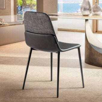 Cassoni Ermes dining chair, gray textured fabric and dark gray leather, curved back with black metal legs.