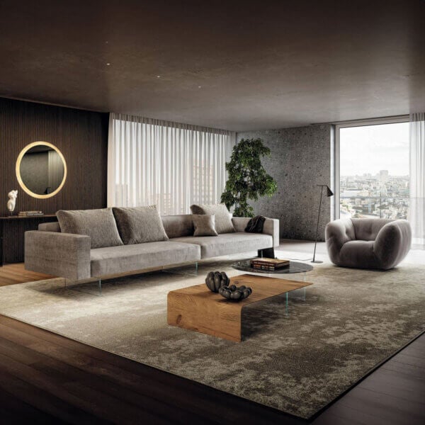 Modular sofa, light gray fabric, square cushions, with gray armchair, live-edge coffee table, and dark wood console in a modern living room.