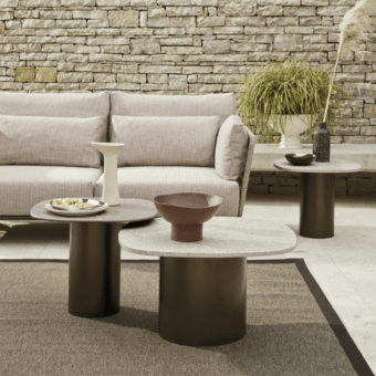 Architectural contemporary coffee table with speckled terrazzo top and dark powder-coated Aisi 304 stainless steel cylindrical base