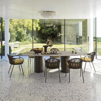 Exceptional Roberti Rattan armchair with yellow cushion and bronze-like powder-coated aluminum frame woven in Round Trendyrope