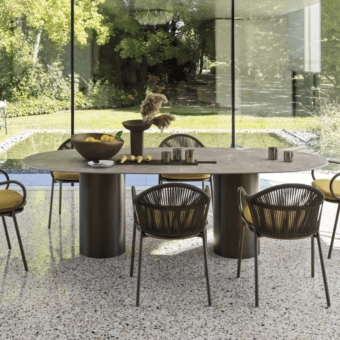 Exceptional Roberti Rattan table with warm gray-brown HPL top and powder-coated Aisi 304 stainless steel double base