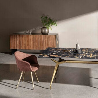 Sophisticated Sovet Italia Arkos table with glossy black and gold tempered glass and lacquered gold aluminum legs