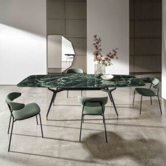 Distinctive Sovet Italia Arkos shaped extendable table with green marbled ceramic top and lacquered black aluminum frame built with gold accents
