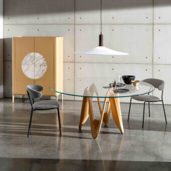 Distinguished Sovet Italia Lambda round table with solid Canaletto walnut wood base and tempered glass top in glossy beige finish